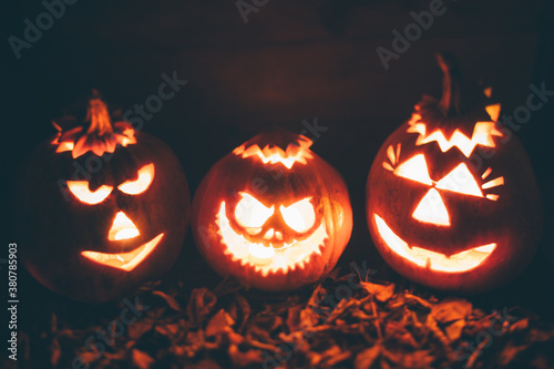 Three Illuminated carved pumpkins