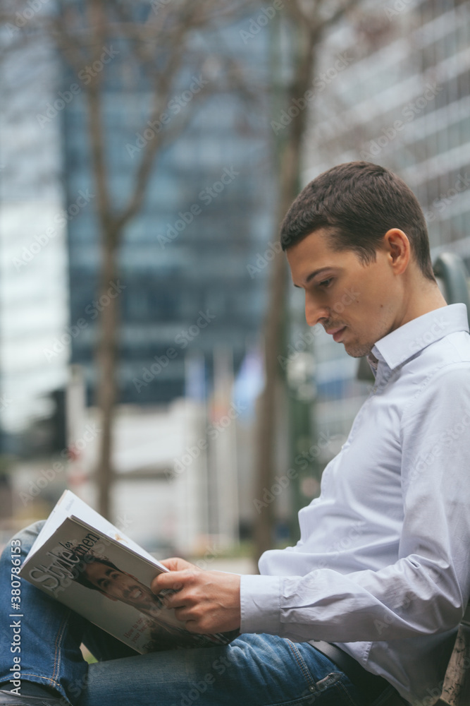 Businessman Reading a Magazine Businessman Reading a Magazine