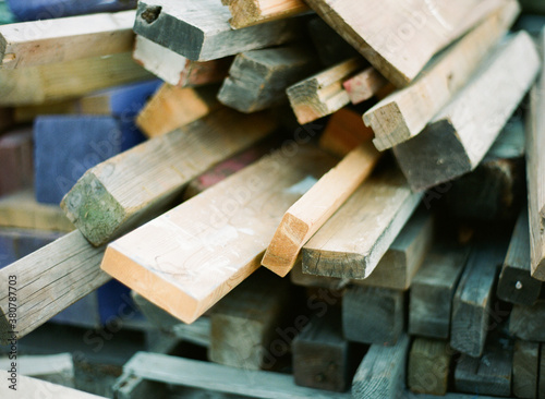 Close up of a pile of scrap colored wood and lumber