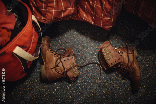 A pair of old boots thrown onto the floor