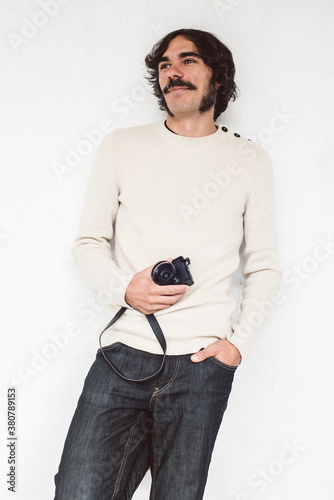 Hipster man with retro camera