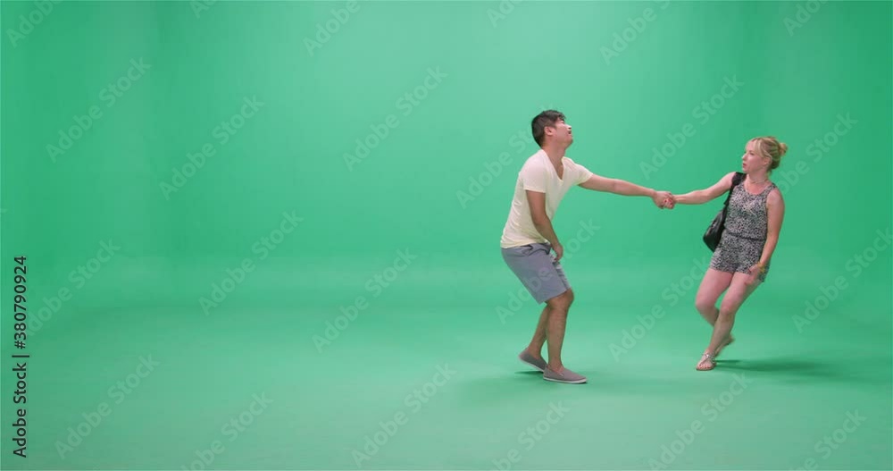 Woman dragging man across screen, greenscreen Woman dragging man across screen, greenscreen