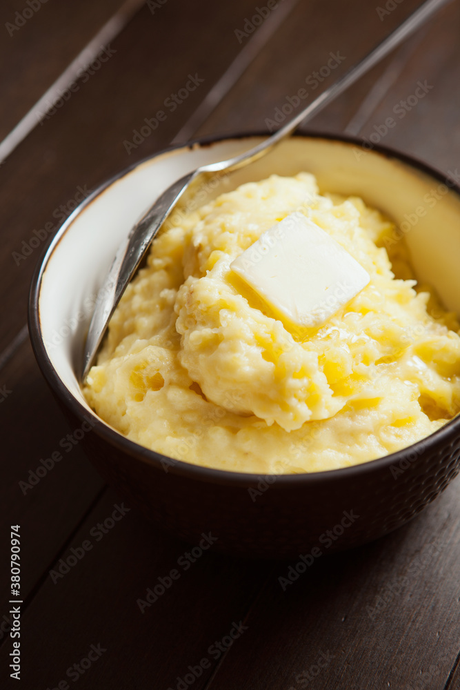 Thanksgiving: Bowl Of Buttered Mashed Potatoes On Table Thanksgiving: Bowl Of Buttered Mashed Potatoes On Table