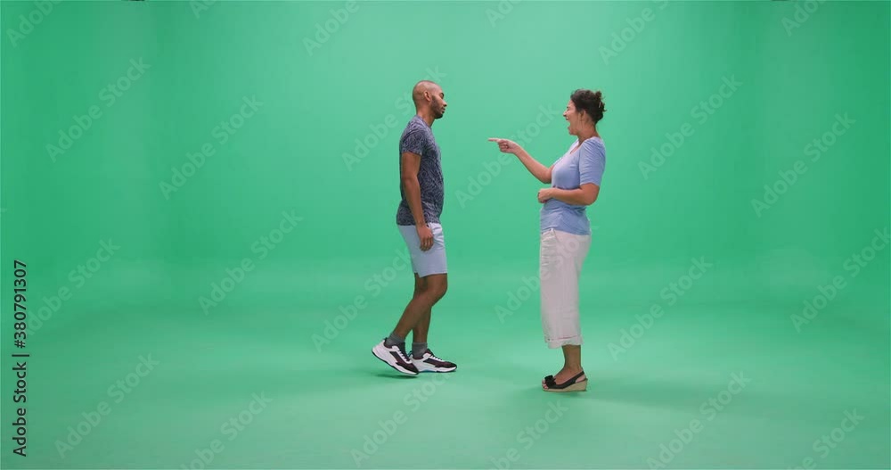 Man and woman passing each other, greenscreen Man and woman passing each other, greenscreen