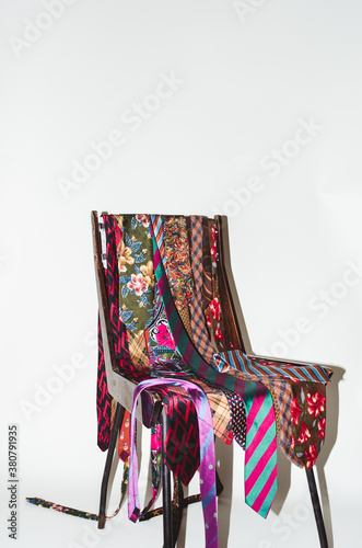 Colorful fancy italian ties on a vintage chair
