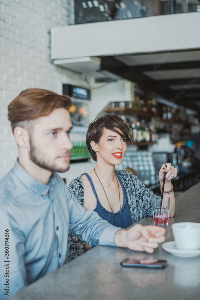 Young people sitting at the cafe