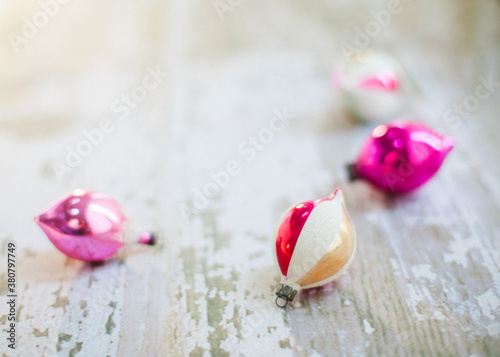 Anique glass ornaments on a white wood background with copyspace photo