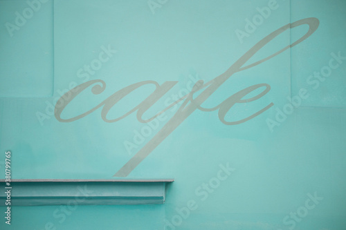 cafe sign on pastel blue background photo