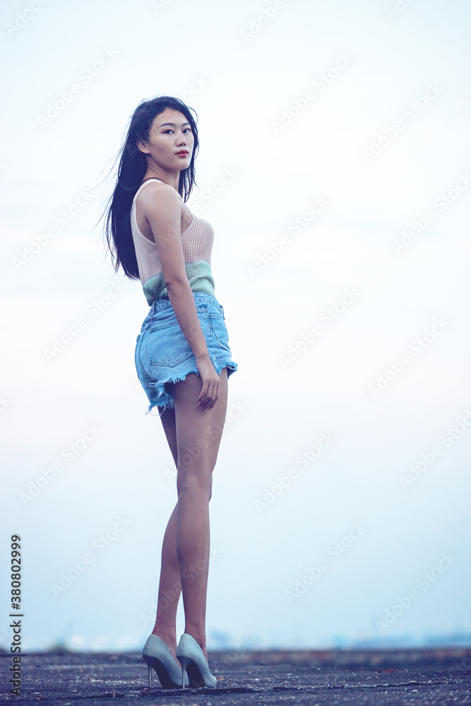 Long legged beauties wearing hot pants and short sleeves outdoors Stock  Photo | Adobe Stock