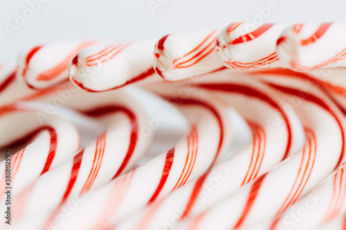 Curled tops of peppermint striped candy canes