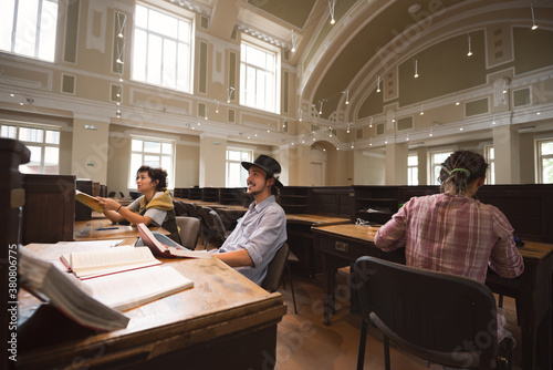 Students looking excited while studying together in the universi photo