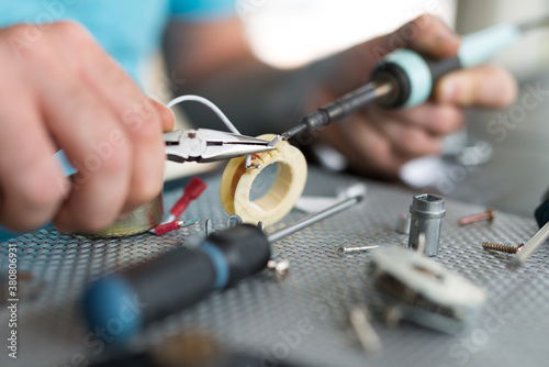 Man Repairing AC Electrical Appliance Motor photo