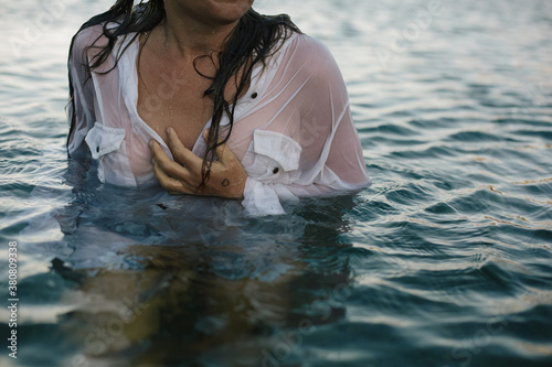 Dressed woman in the water