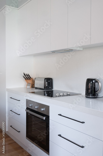 Modern fitted kitchen with induction cooktop