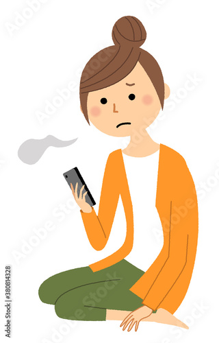 スマートフォンを見ながらため息をつく若い女性