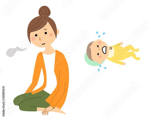 泣いている赤ちゃんとため息をつく若い女性