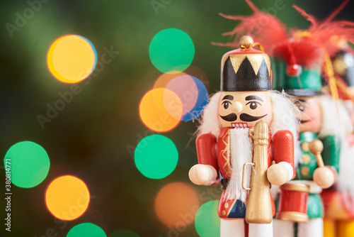 Colorful Christmas nutcrackers with out of focus colored light background