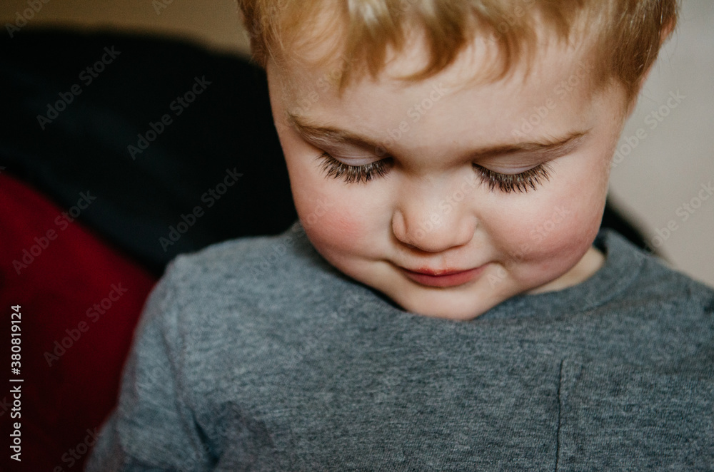 little boy in a moment of quiet little boy in a moment of quiet