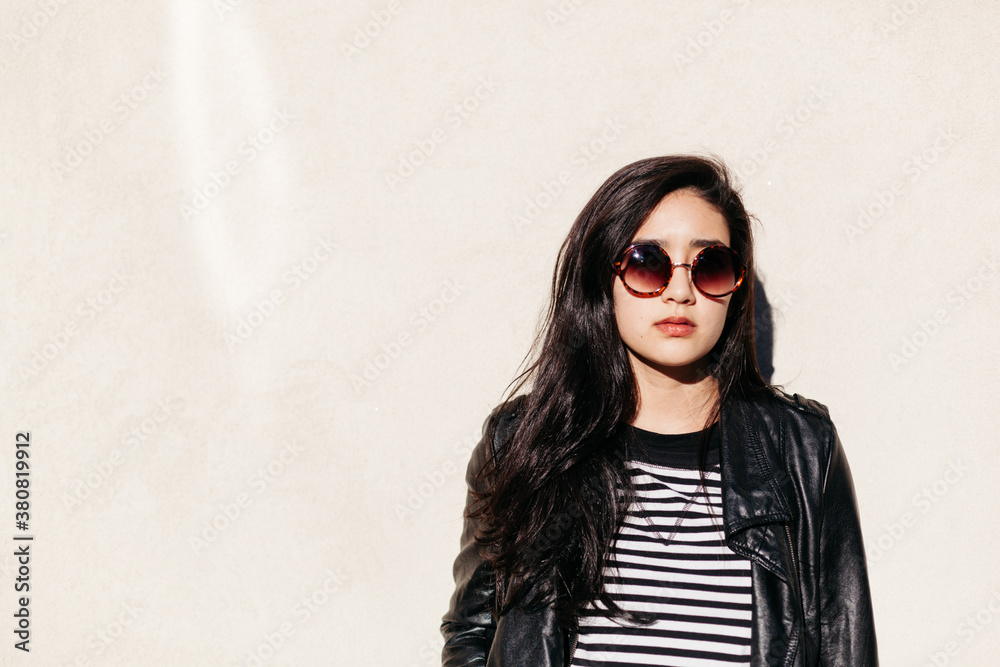 Beautiful woman wearing a black leather jacket