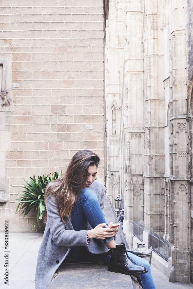 Woman using her mobile phone in the streets of BArcelona Woman using her mobile phone in the streets of BArcelona