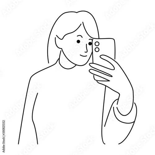Fototapeta Naklejka Na Ścianę i Meble -  Cute happy woman holding cellphone