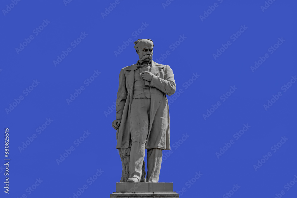 Dnipro, Ukraine - July 21, 2020:  Taras Shevchenko Monument on Monastyrsky Island in Dnipro, close up isolated on a blue sky background. Cast iron sculpture was installed in 1959. Author - Ivan Znoba