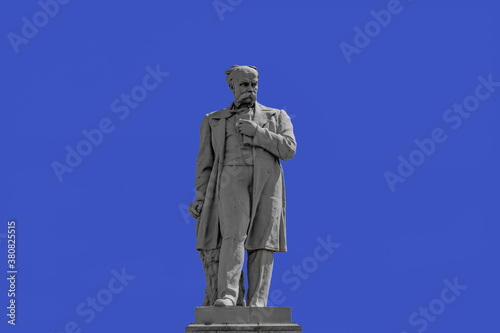 Dnipro, Ukraine - July 21, 2020:  Taras Shevchenko Monument on Monastyrsky Island in Dnipro, close up isolated on a blue sky background. Cast iron sculpture was installed in 1959. Author - Ivan Znoba