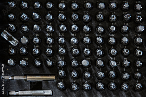 Collection of drill bits organized in a mechanic's suitcase photo