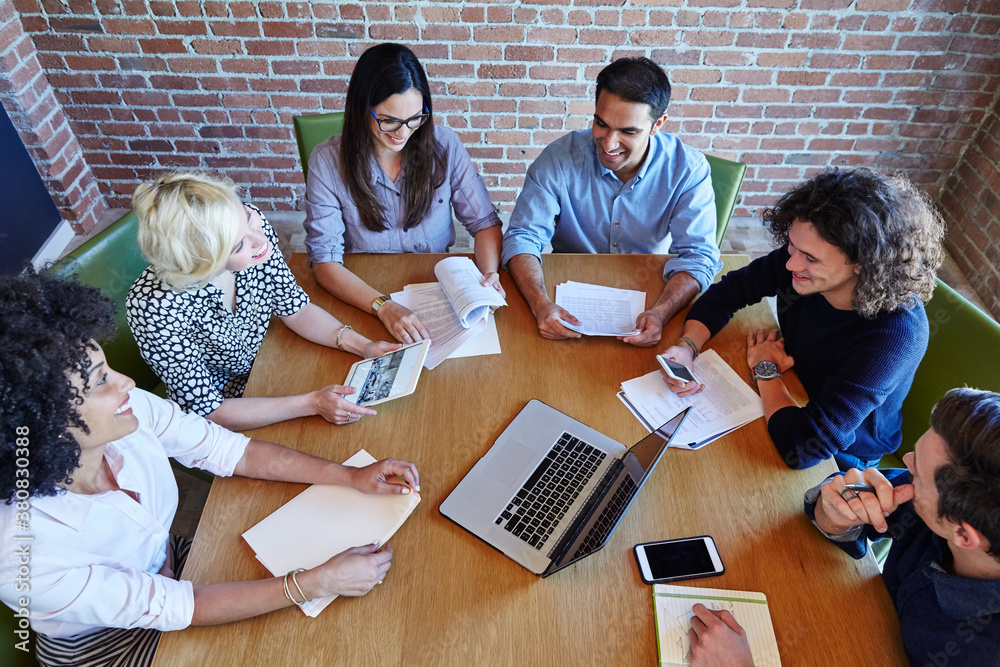 Group of millennials in meeting at start up business Group of millennials in meeting at start up business