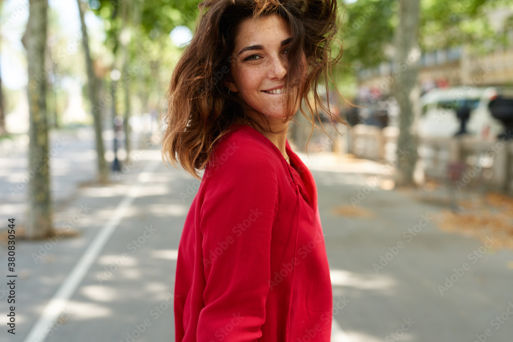 smiling woman walking around the city smiling woman walking around the city