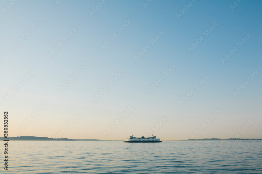 Washington State ferry boat on calm waters of Puget Sound at dusk