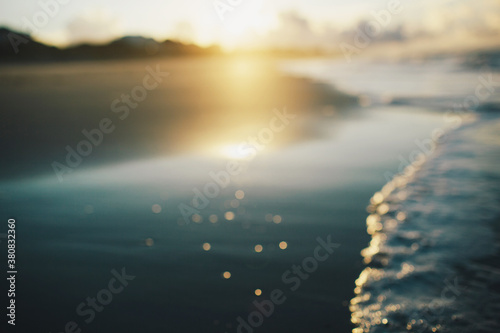 intentionally blurred image of sunrise at the beach photo