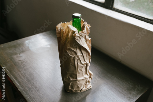 Beer Bottle Inside Paper Bag