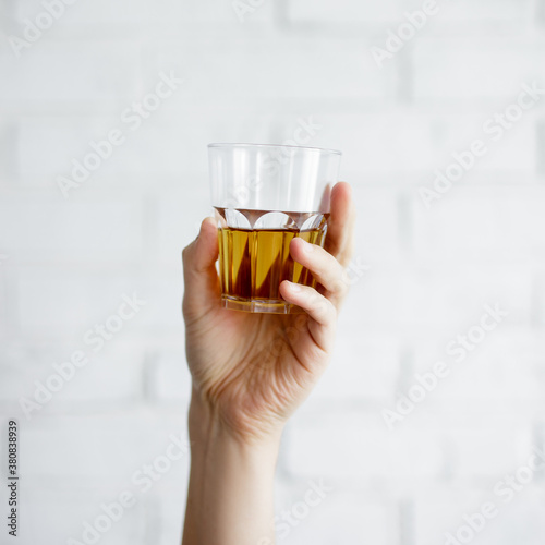 person holding a glass of wine