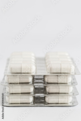 Closeup of white capsules in blister pack