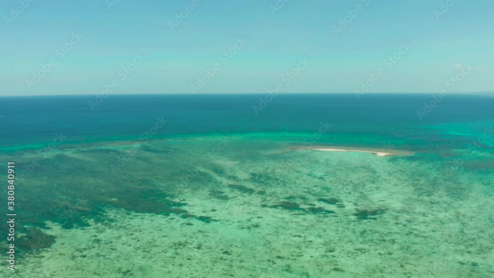 Small sandy beach on a coral atoll in turquoise water, aerial view. Summer and travel vacation concept. Balabac, Palawan, Philippines. Small sandy beach on a coral atoll in turquoise water, aerial view. Summer and travel vacation concept. Balabac, Palawan, Philippines.