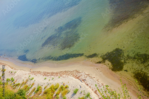 Beautiful shallow sea with vegetation around bay photo