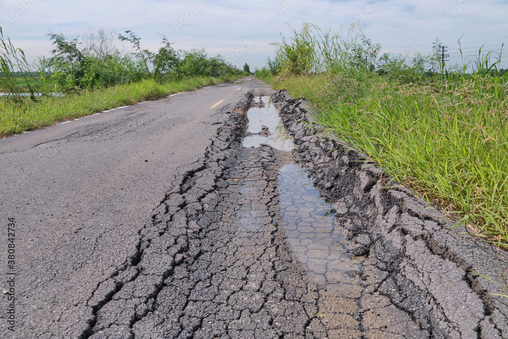 Asphalt surface on the street was demolished due to poor construction. Asphalt surface on the street was demolished due to poor construction.