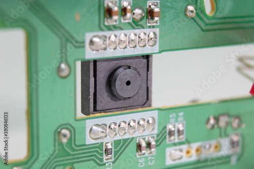 Mouse pointer optical sensor ccd chip on green printed circuit board photo
