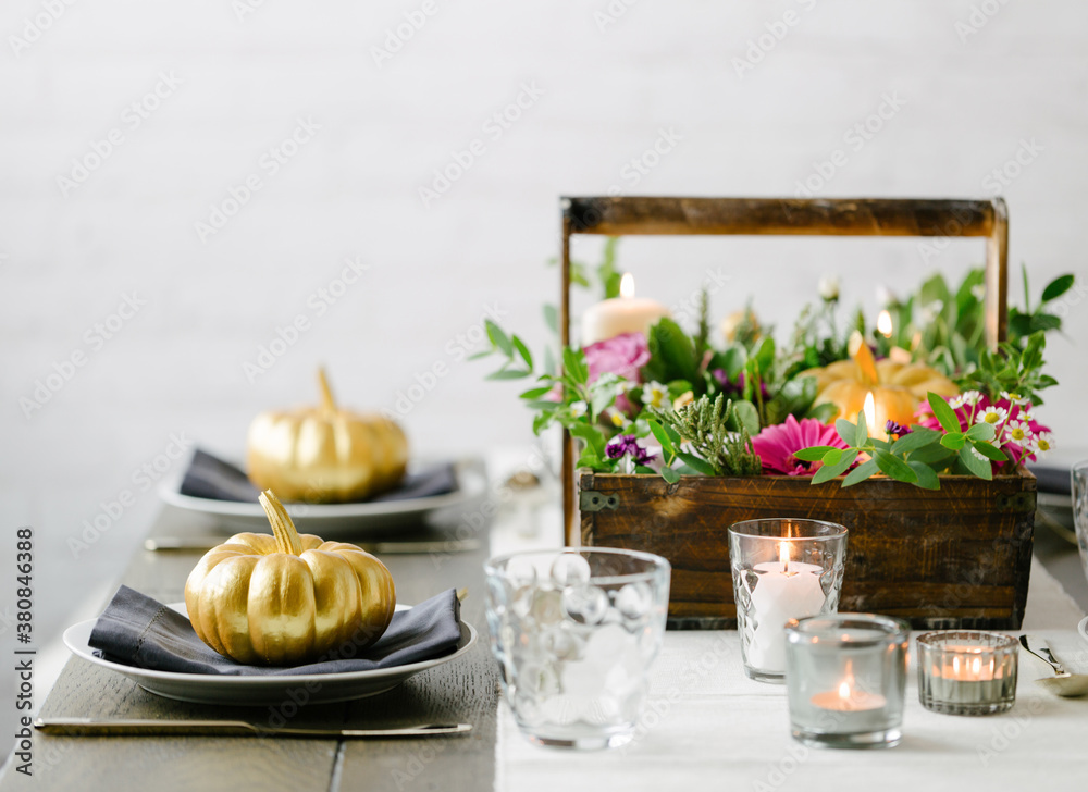 Pumpkin and flower tablescape decor for Thanksgiving or Halloween