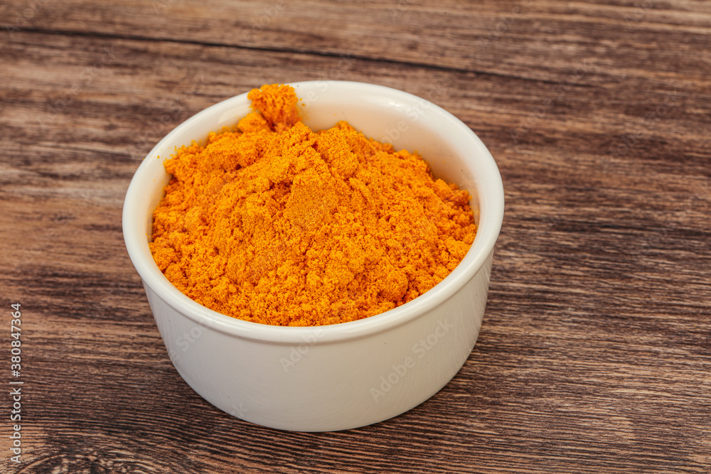 Tumeric powder in the bowl Tumeric powder in the bowl