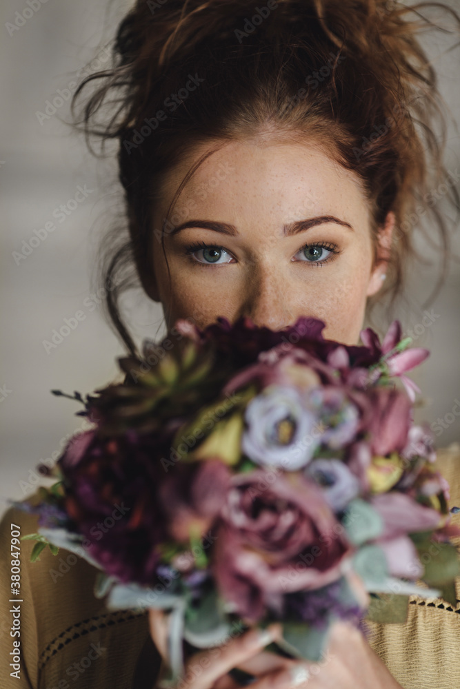 Woman Holding a Flower Bouquet Woman Holding a Flower Bouquet
