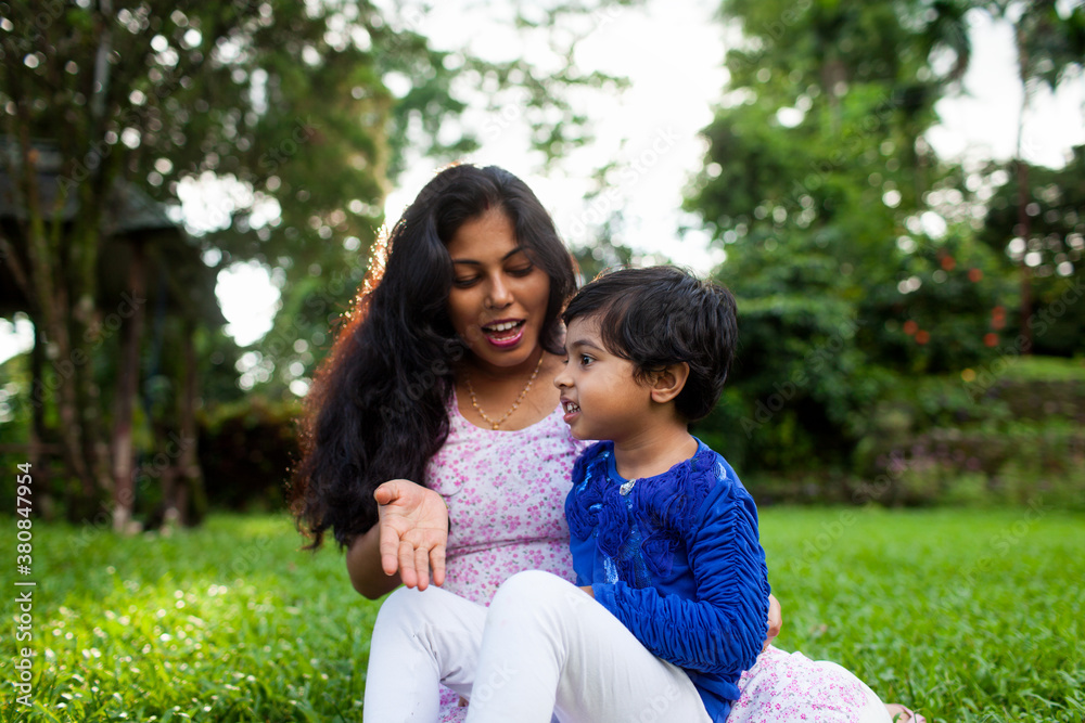 Little girl sharing cheerful moment with her mother Little girl sharing cheerful moment with her mother