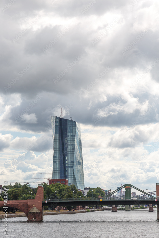 Glass and metal building and dramatic cloudy sky Glass and metal building and dramatic cloudy sky