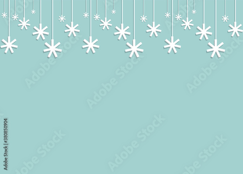paper voluminous snowflakes hanging from the ceiling on strings