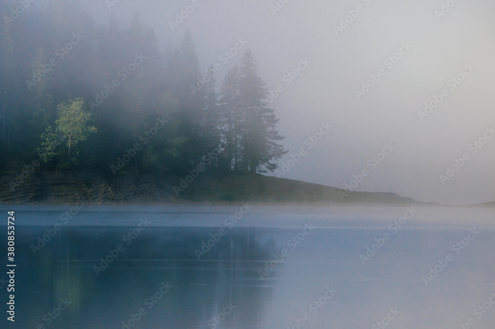 Fog above the lake in the morning Fog above the lake in the morning
