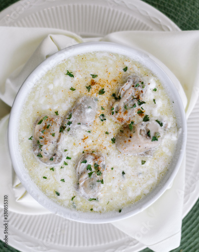 Soup with oysters in bowl photo