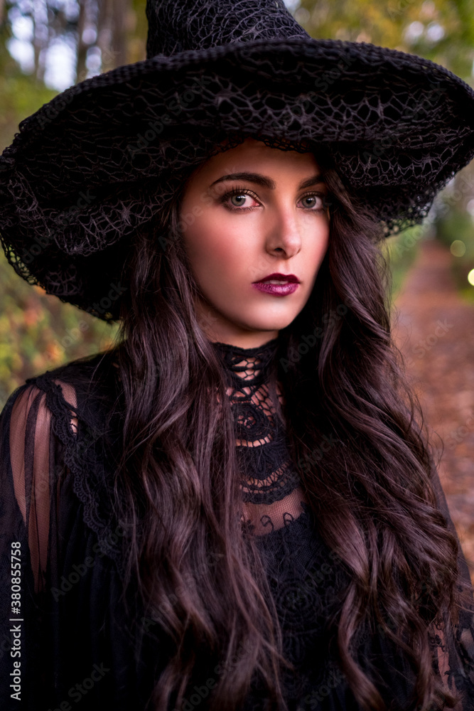 Beautiful woman in witch costume celebrating Halloween Beautiful woman in witch costume celebrating Halloween