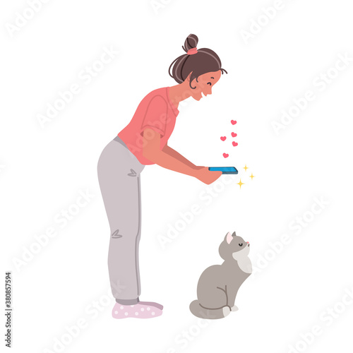 Cat photographer. Portrait of a girl taking photo of a cranky cat. Vector 8 EPS.