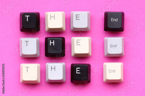 'The end' written with computer keyboard keys on a paper background